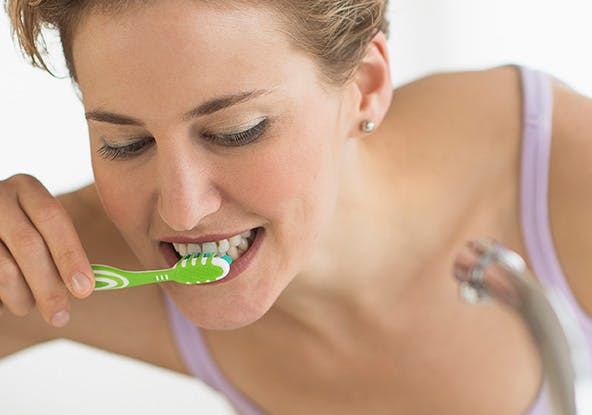 Woman brushing her teeth