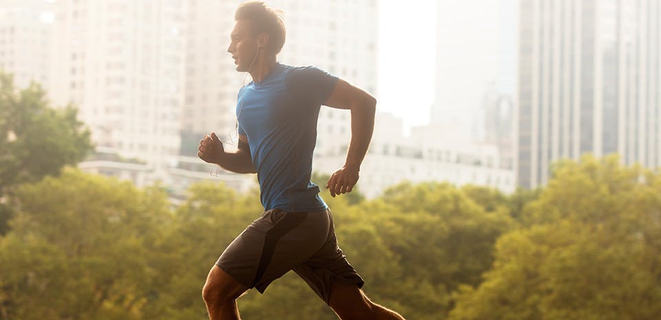 Side profile of a man jogging | Move during the day