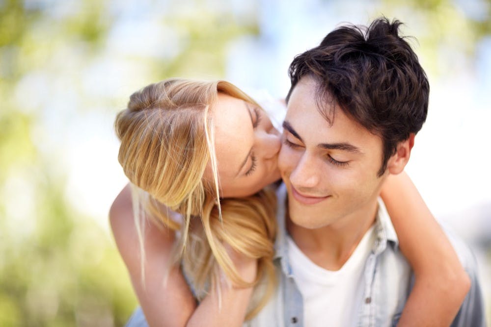 Girl kisses her friend