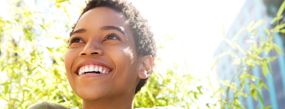 Young healthy woman smiling outdoors