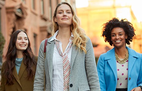 three women walking with confidence