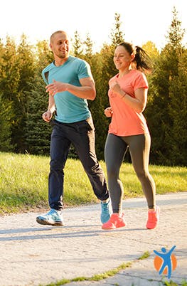 A young couple jogging in the park