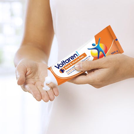 Woman squeezing Voltaren gel onto her hand