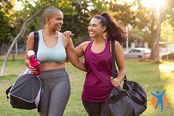 Two women walking after a workout to help maintain a healthy weight