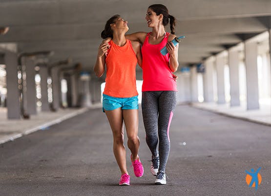 Two women exercising to reduce strain on their joints