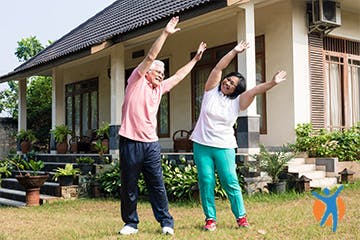 A couple stretching outside their house yoga, doing yoga stretching exercises