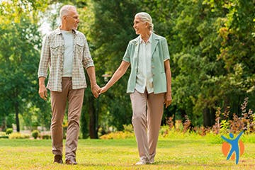 Taking a walk An older couple walking in the park - keeping moving is a great way to ease pain in the joints