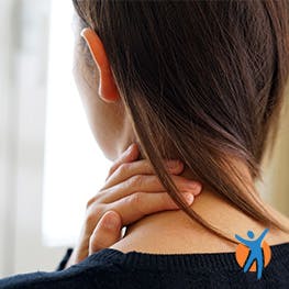 Woman experiencing neck in pain - Voltarol helps you understand why neck pain occurs and what you can do about it