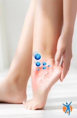 A person rubbing their ankle