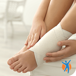 Find some remedies for your pain Woman compresses ankle pain with bandage as part of RICE method