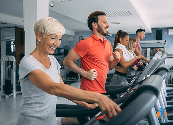 Group enjoying a gym workout - encourage osteoarthritis recovery through maintaining your fitness