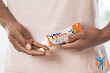 Close-up of somone using Voltarol gel, used for Osteoarthritis joint pain relief Close-up of somone using Voltarol gel, used for Osteoarthritis joint pain relief