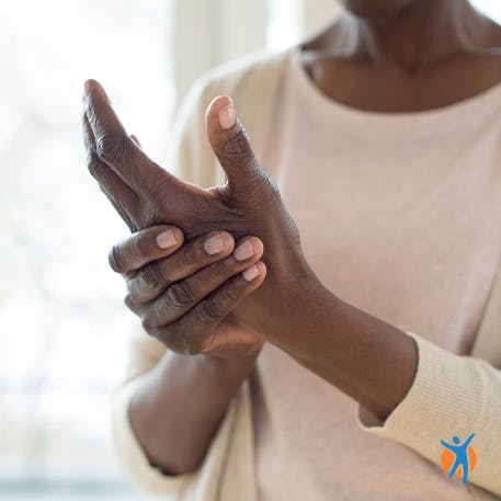 Woman holding sore wrist