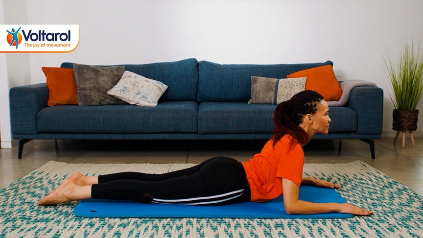 $imgtitle Woman lying on the floor stretching