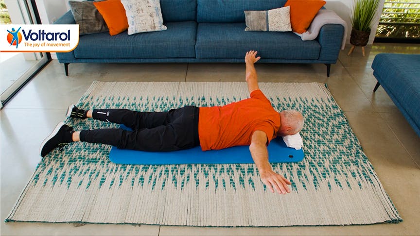 $imgtitle Man lying on his stomach with arms spread