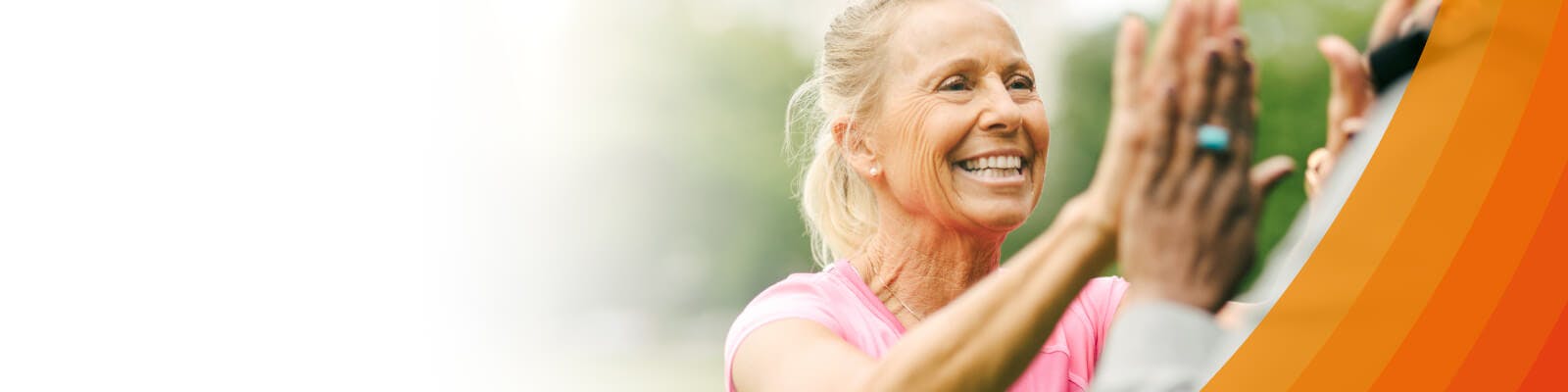 A woman greeting her friend with a high five
