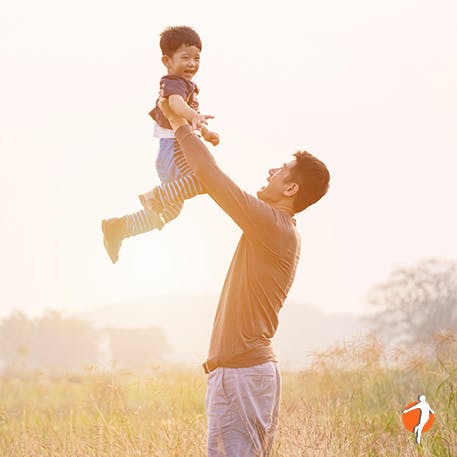 Dad and child playing in nature