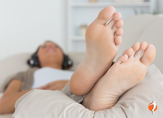 Woman lying on sofa relaxing