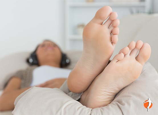 Woman lying on sofa relaxing Woman lying on sofa relaxing