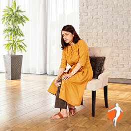 Finding treatments for your pain Woman on chair holding her knee