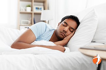 Man sleeping in bed 