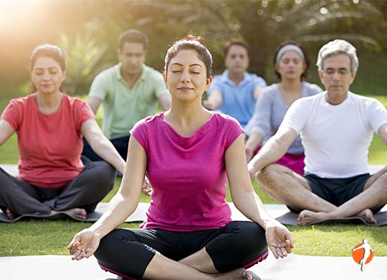 Six people meditating