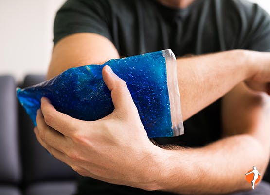 Icing your joints to help with Osteoarthritis pain Man icing his elblow