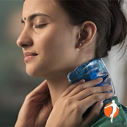 Woman putting ice on her neck