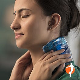 Loosening up a stiff neck Woman putting ice on her neck