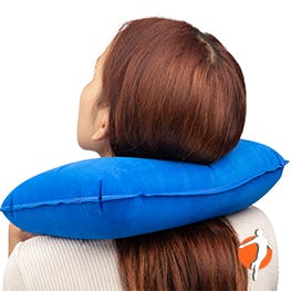Woman using a neck pillow