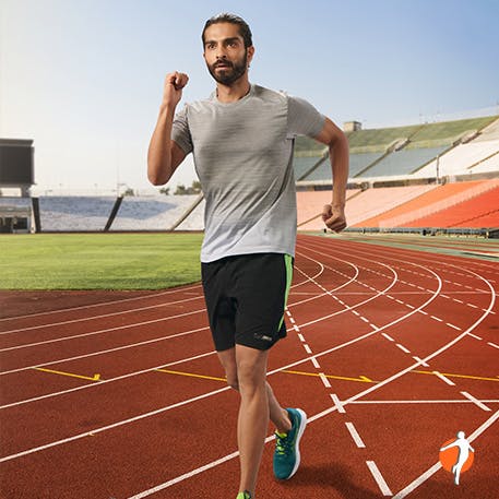Man running on the race track