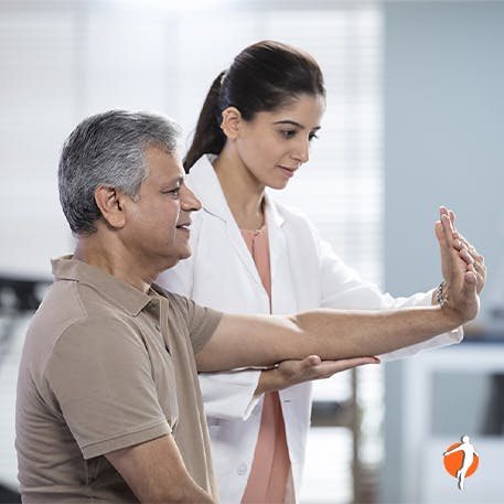 Man with physical therapist doing a shoulder exercise