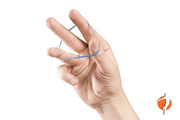 Man using a rubber band to exerccise his hand