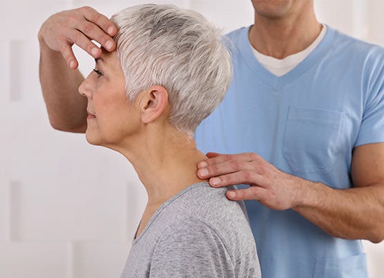 Medical professional showing a woman proper posture