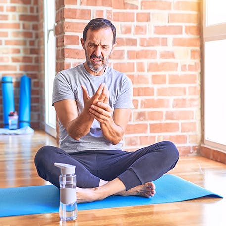 Man seated in a yoga pose Man seated in a yoga pose