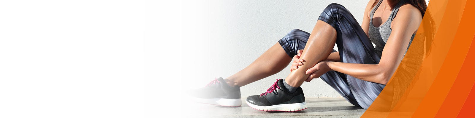 Woman holding her ankle - learn about ankle and foot pain