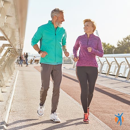 Elderly couple jogging - learn about the causes and symptoms of ankle injuries