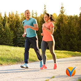 A young couple jogging in the park