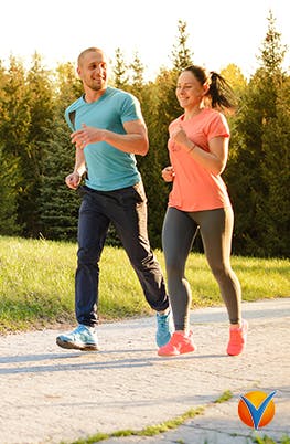 A young couple jogging in the park