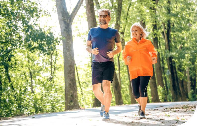Couple running in the forest