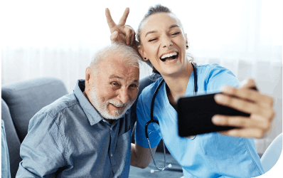 Happy nurse and patient taking a photo