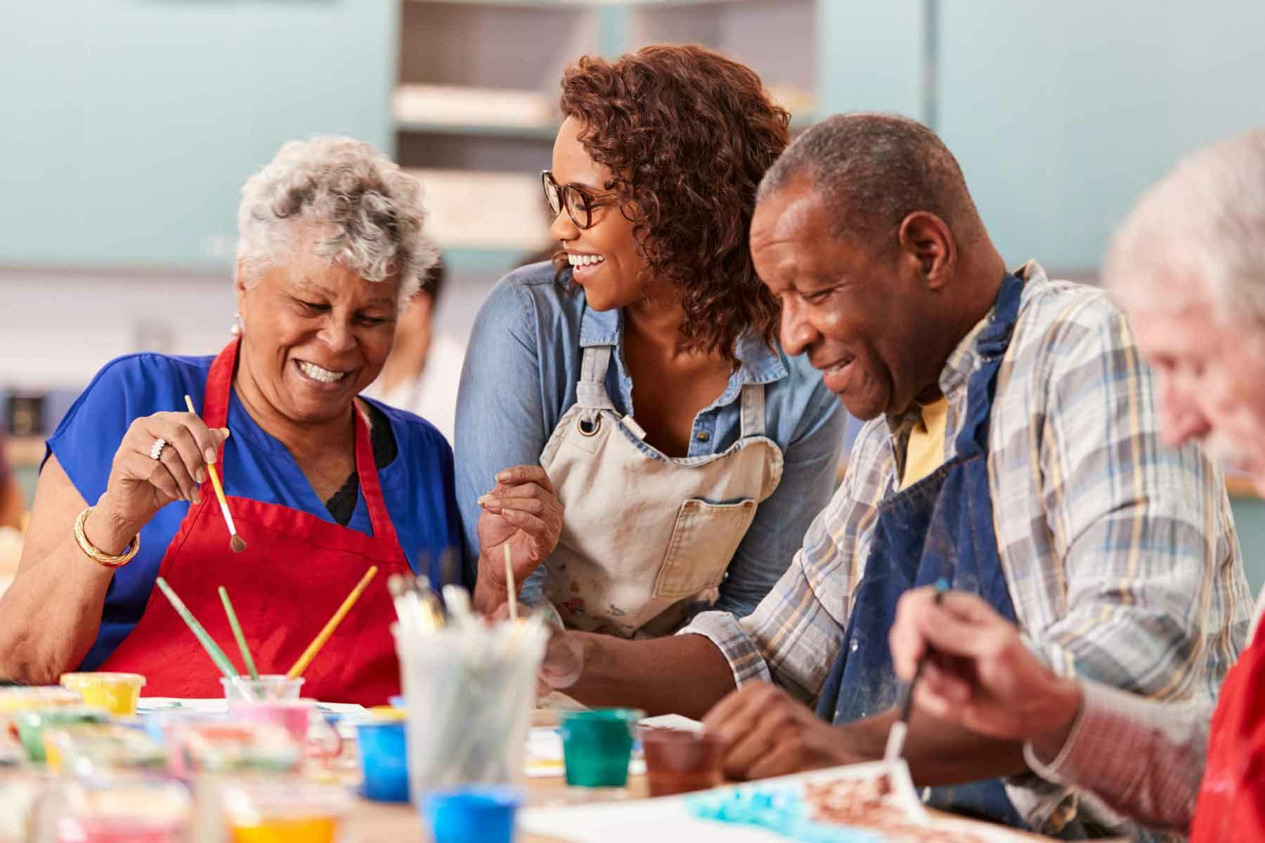 Diverse group of seniors participating in art class