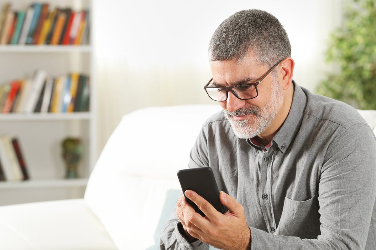 man looking at phone