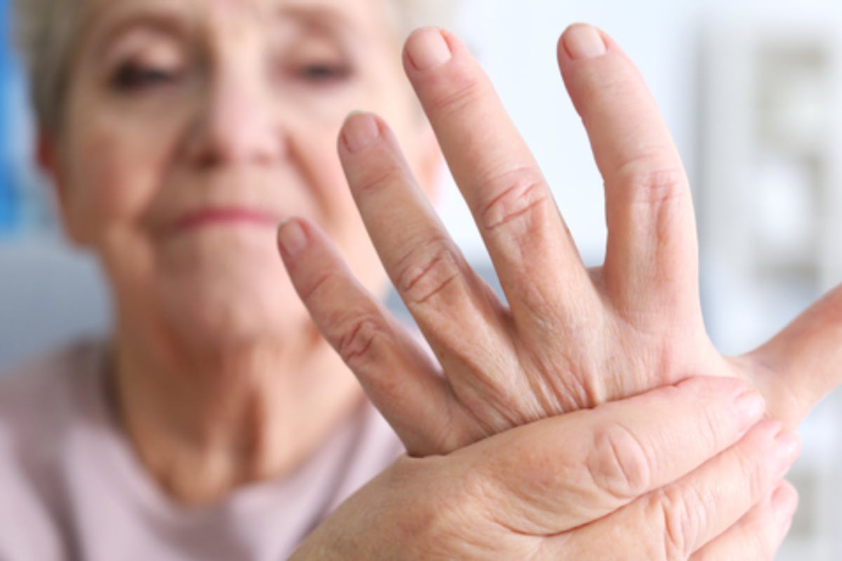 Elderly woman suffering from hand pain