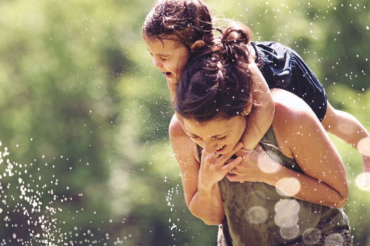 Mother with a child on her back