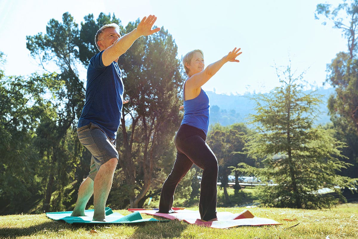 Man and woman doing yoga