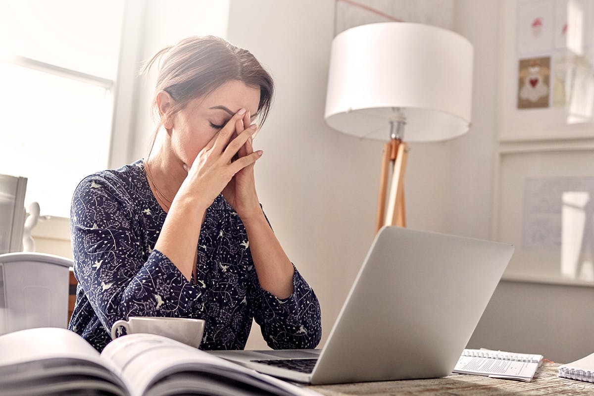 Stressed woman sitting at computer