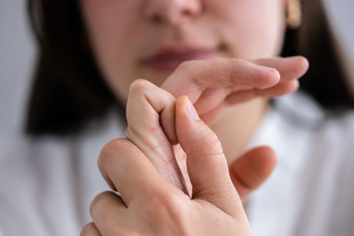 Woman cracking her fingers in a close up shot