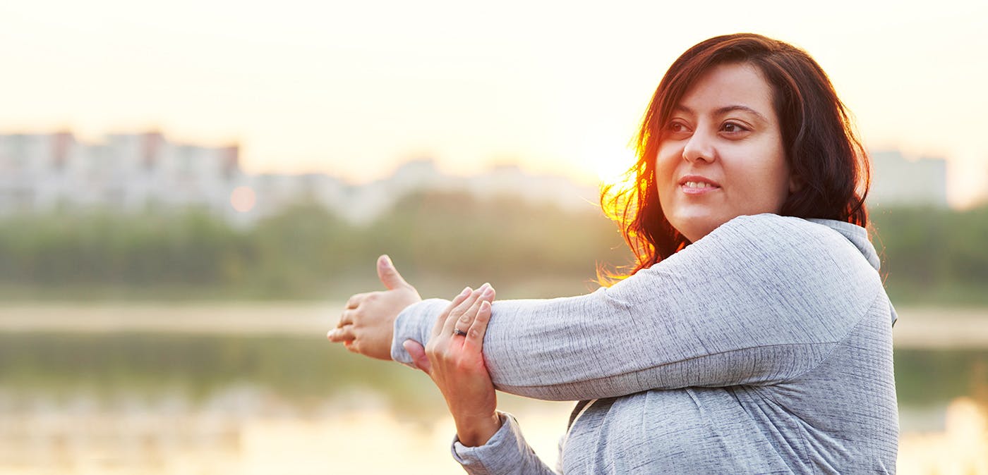 Person holding wrist in pain