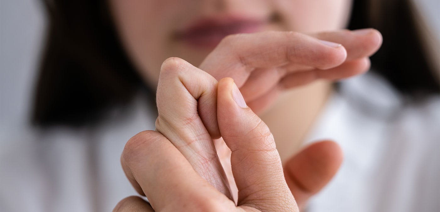 Woman cracking her fingers in a close up shot